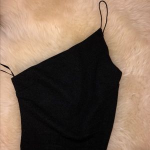 One shoulder black top.
